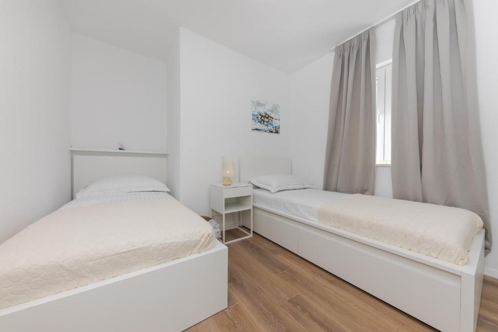 Posteľ alebo postele v izbe v ubytovaní Enjoy Trogir Ciovo