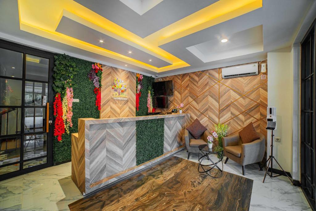 Area soggiorno di Tree Homestay Mitra RedDoorz