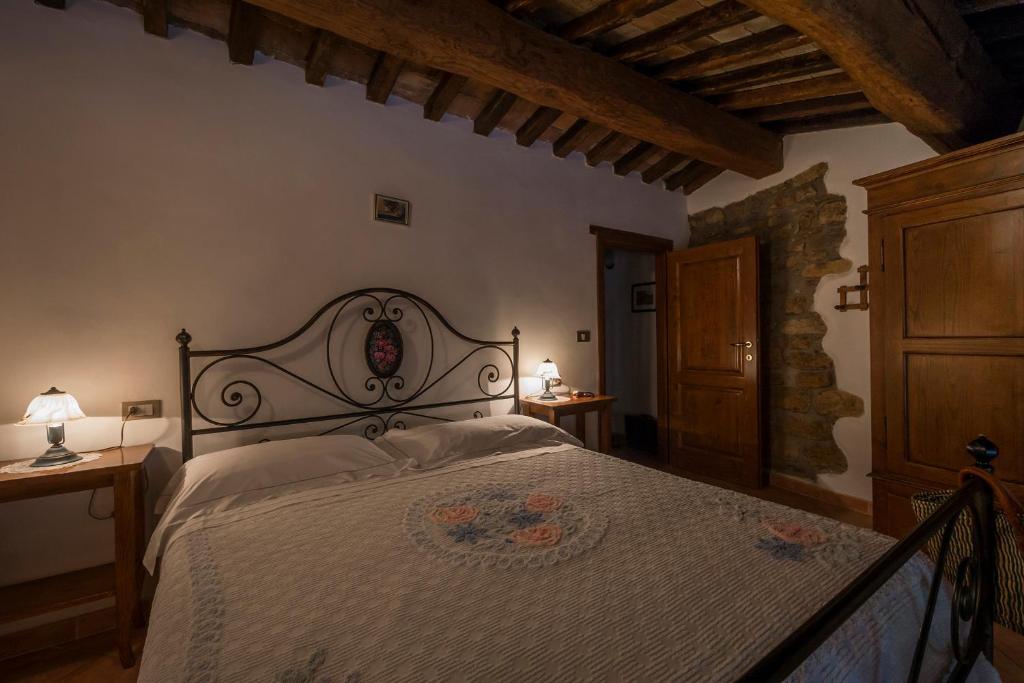 Postel nebo postele na pokoji v ubytování Agriturismo Monte Acuto