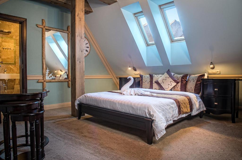A bed or beds in a room at Mountain Resort Ždiar - River