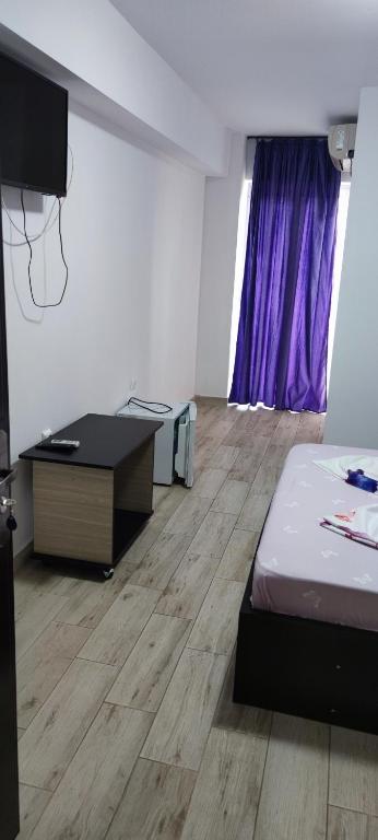 Postel nebo postele na pokoji v ubytování Vila Axel