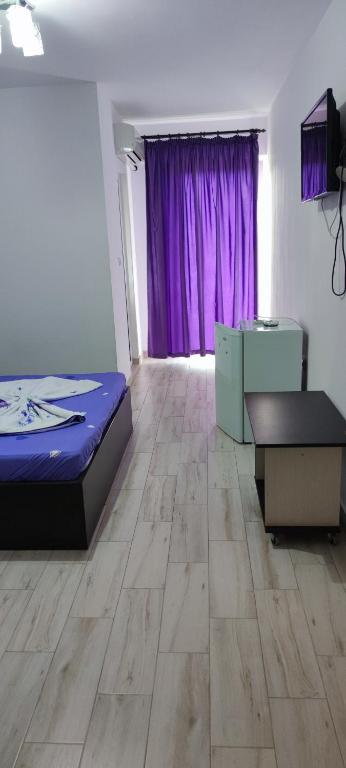 Postel nebo postele na pokoji v ubytování Vila Axel