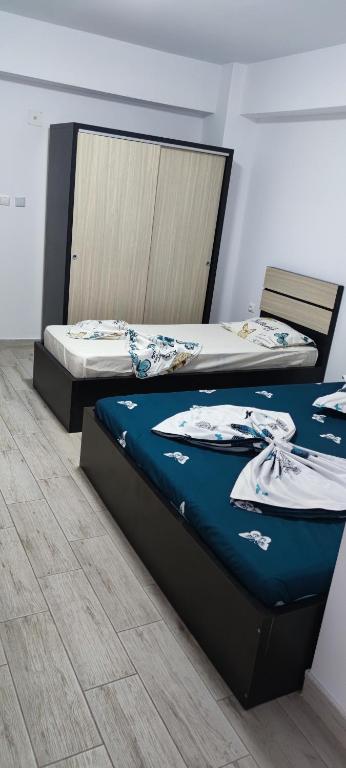 Postel nebo postele na pokoji v ubytování Vila Axel