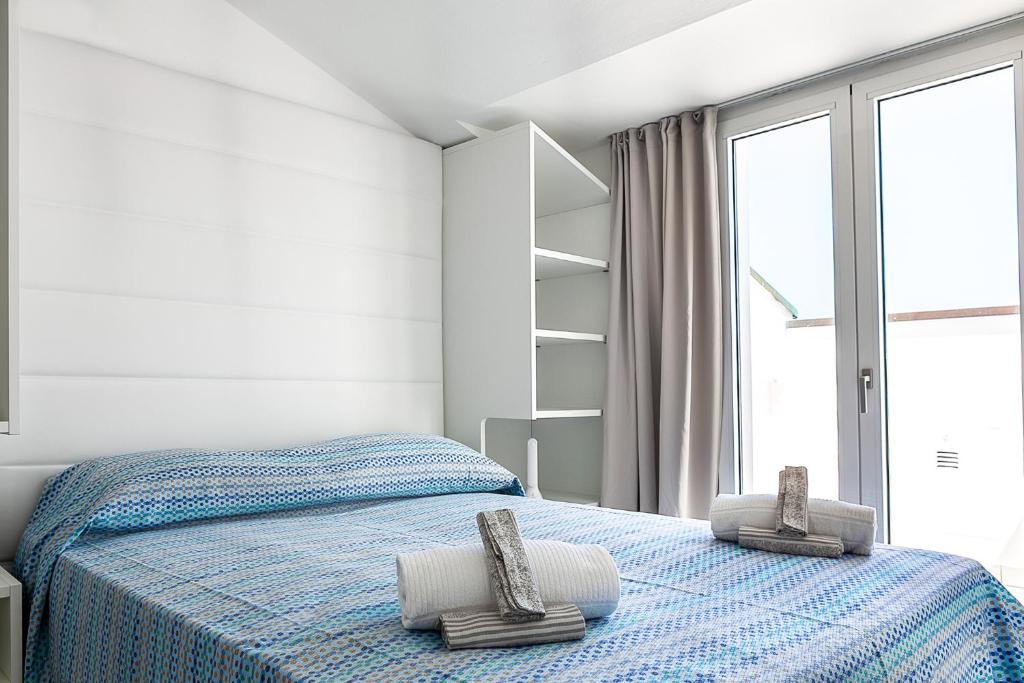 Postel nebo postele na pokoji v ubytování Hotel Ninfea Cattolica