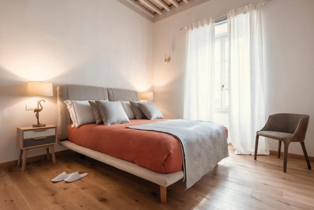 Llit o llits en una habitació de Palazzo Degli Archi