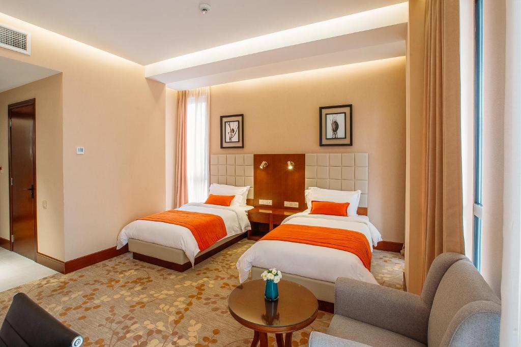 Postel nebo postele na pokoji v ubytování Horizont Hotel Tbilisi