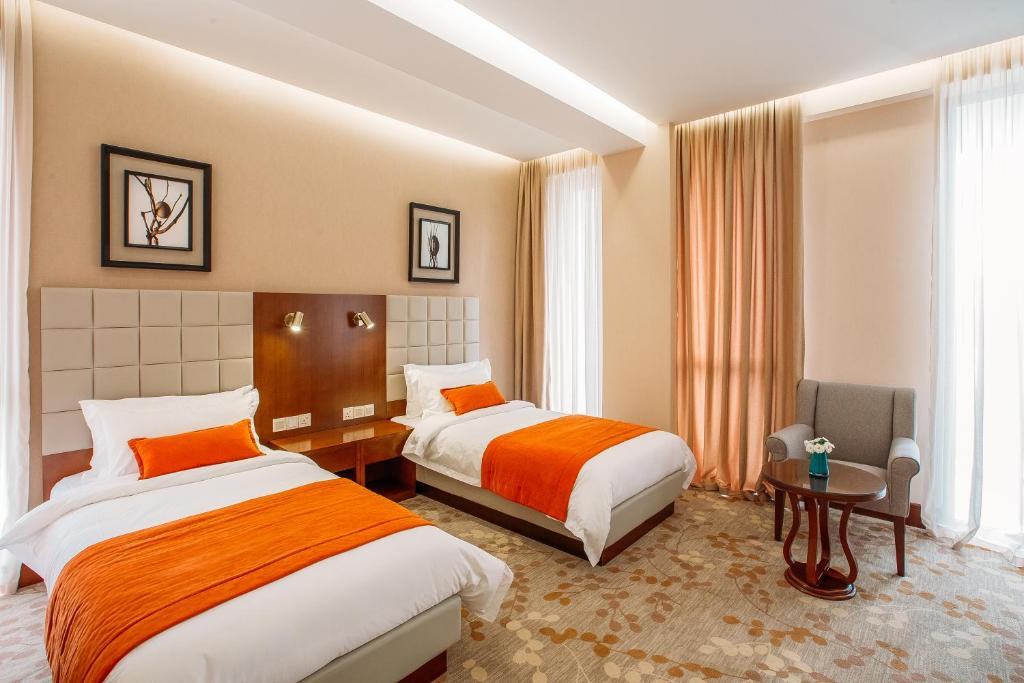 Postel nebo postele na pokoji v ubytování Horizont Hotel Tbilisi