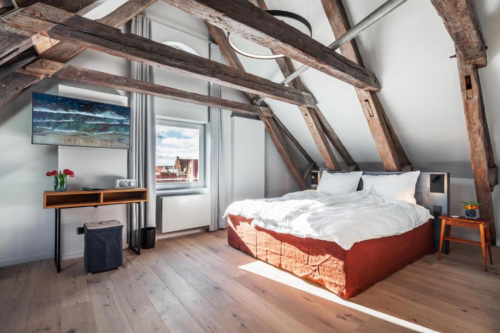 Postel nebo postele na pokoji v ubytování Hotel Die Reederin