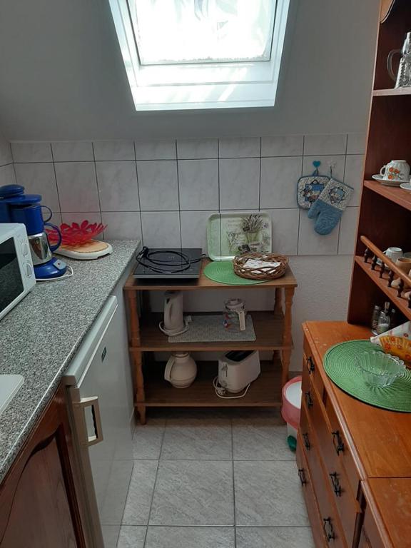 Kuchyňa alebo kuchynka v ubytovaní Major család apartman