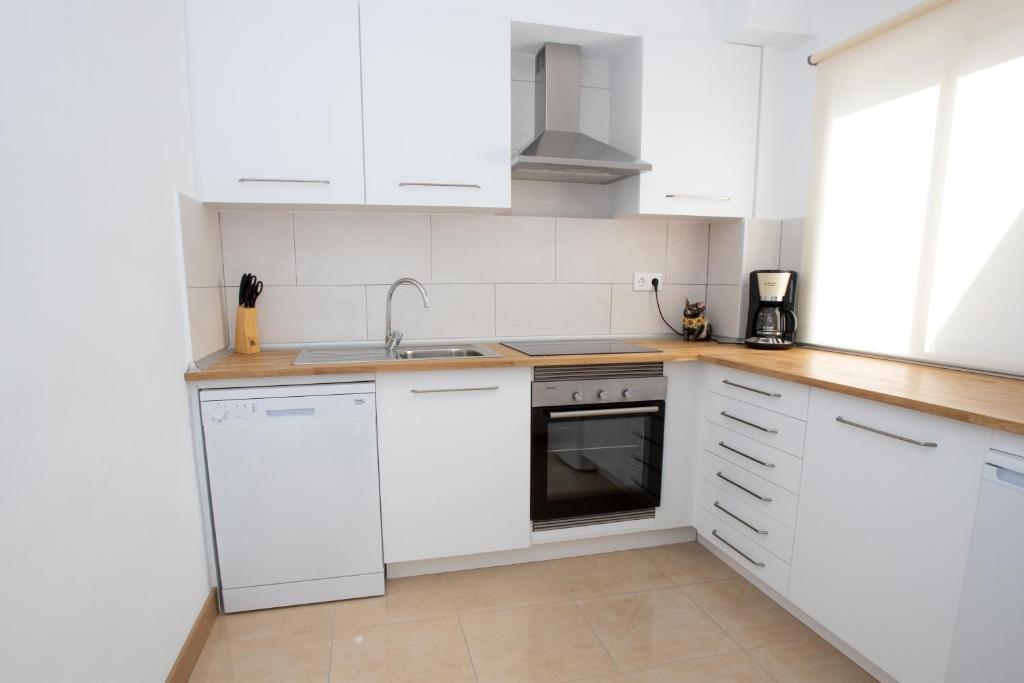 Kuchyň nebo kuchyňský kout v ubytování Apartment Costa Blanca