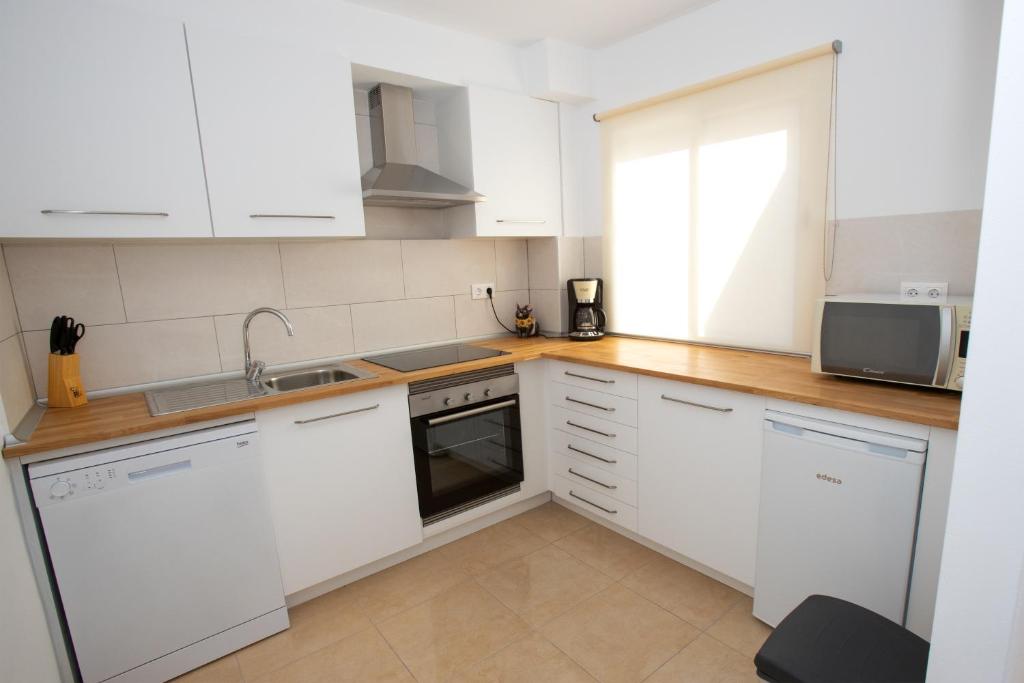 Kuchyň nebo kuchyňský kout v ubytování Apartment Costa Blanca