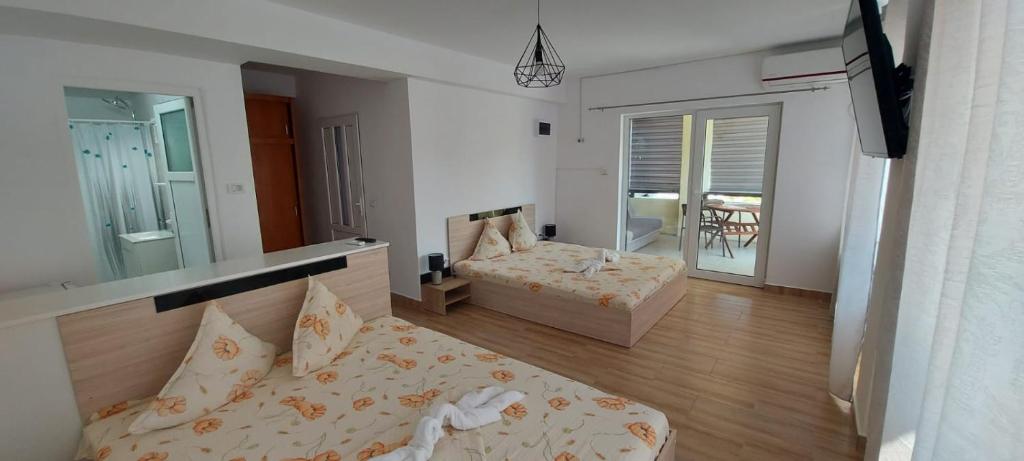 Postel nebo postele na pokoji v ubytování Casa Francisc