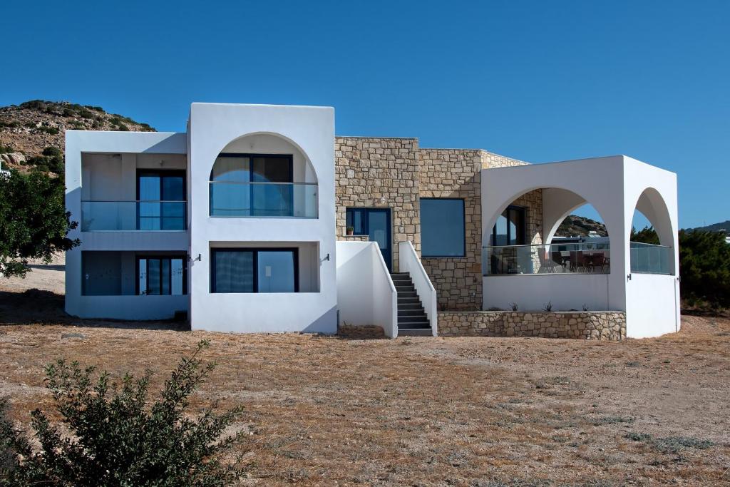 a house in the middle of a field at Aelia Luxury Villa in Amoopi