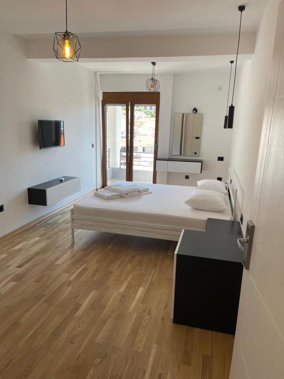 Postel nebo postele na pokoji v ubytování Poseidon Apartments