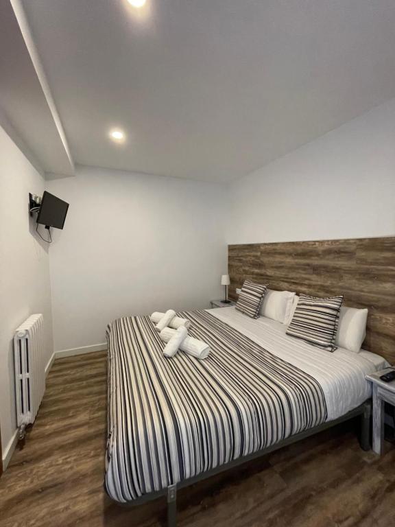 Postel nebo postele na pokoji v ubytování Aparthotel Sant Andreu