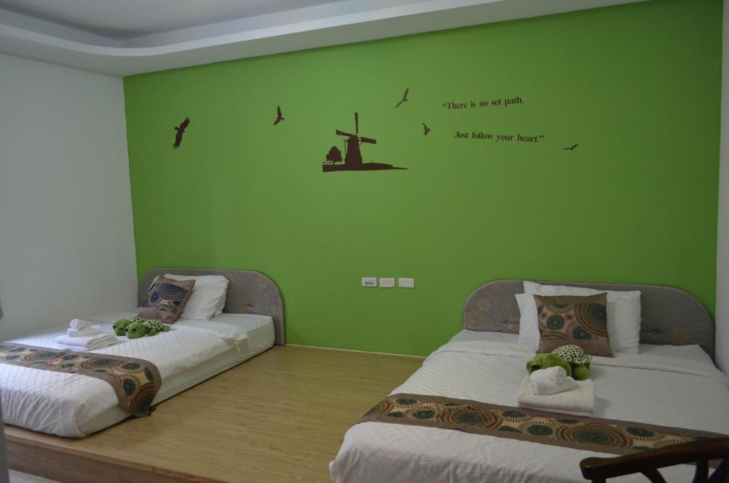 Postel nebo postele na pokoji v ubytování Nandian Homestay
