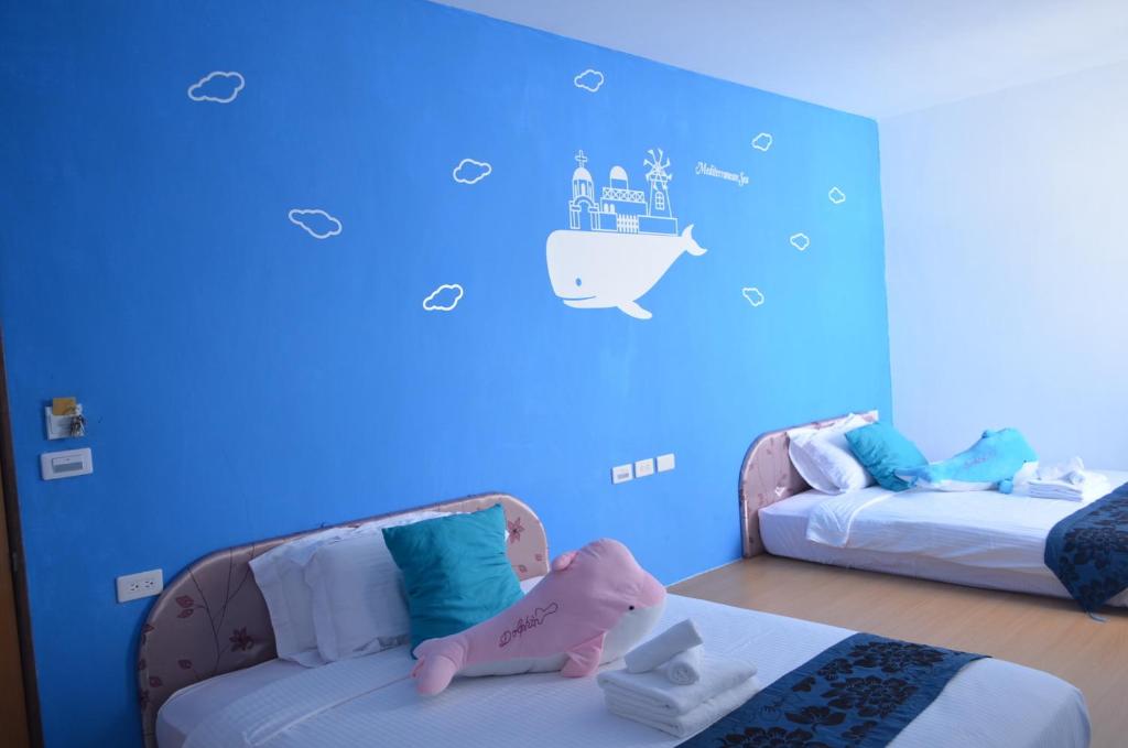 Postel nebo postele na pokoji v ubytování Nandian Homestay