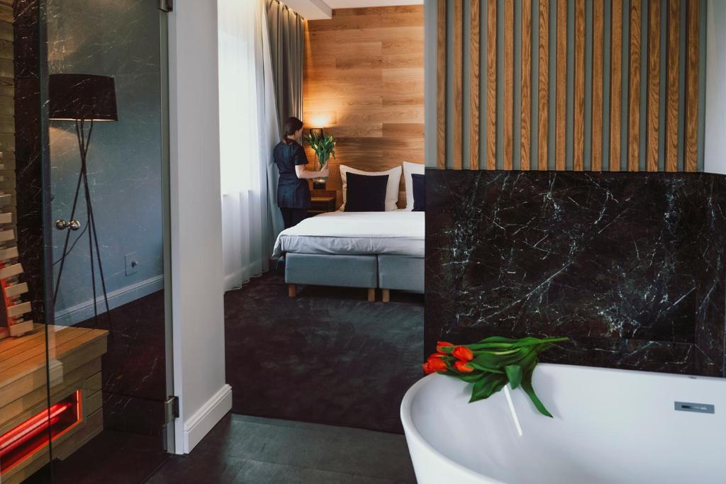 Postel nebo postele na pokoji v ubytování Caryńska Resort & SPA