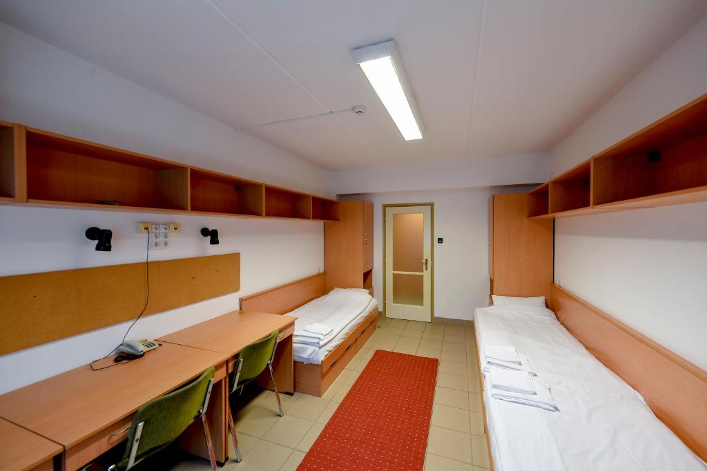 Postel nebo postele na pokoji v ubytování KLK Hotel