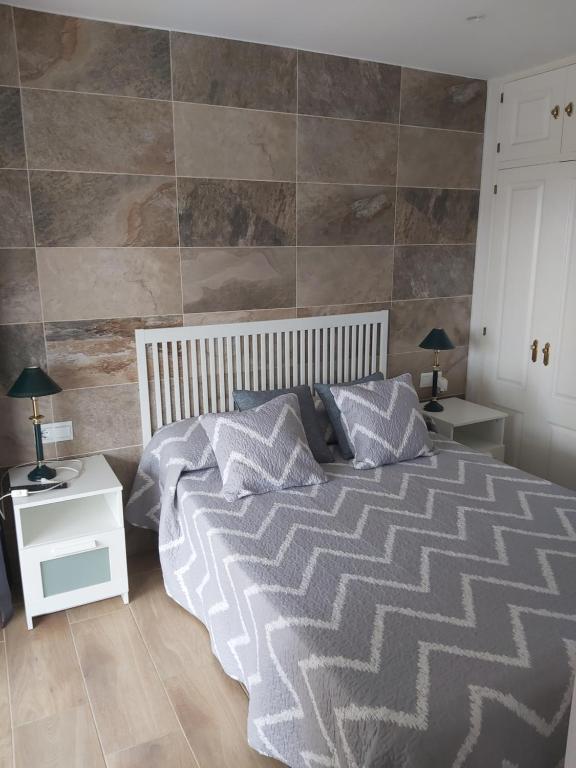 Posteľ alebo postele v izbe v ubytovaní CABOMOLINOS, APARTAMENTO108