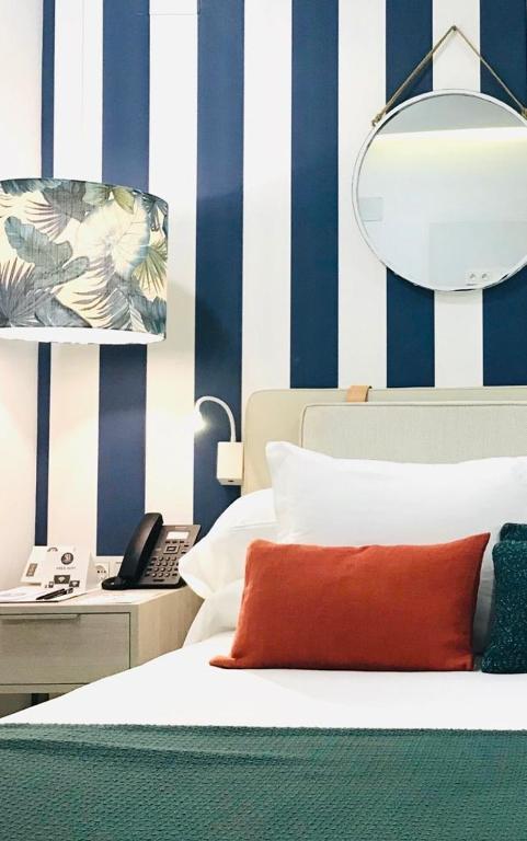 Posteľ alebo postele v izbe v ubytovaní Soho Boutique Urban