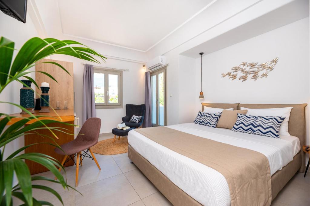 Postel nebo postele na pokoji v ubytování Kalisperis Hotel