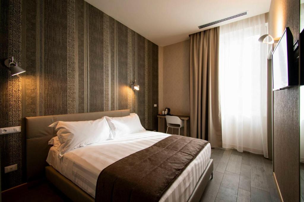 Postel nebo postele na pokoji v ubytování Hotel Medusa