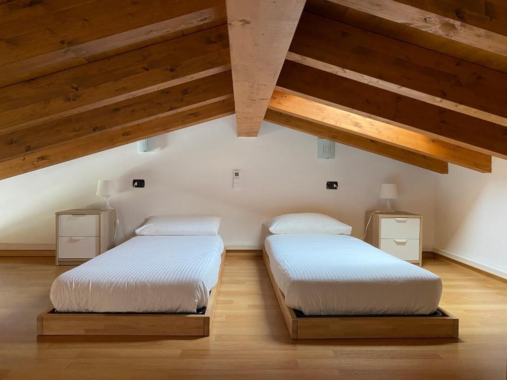 Postel nebo postele na pokoji v ubytování La Valletta Suite