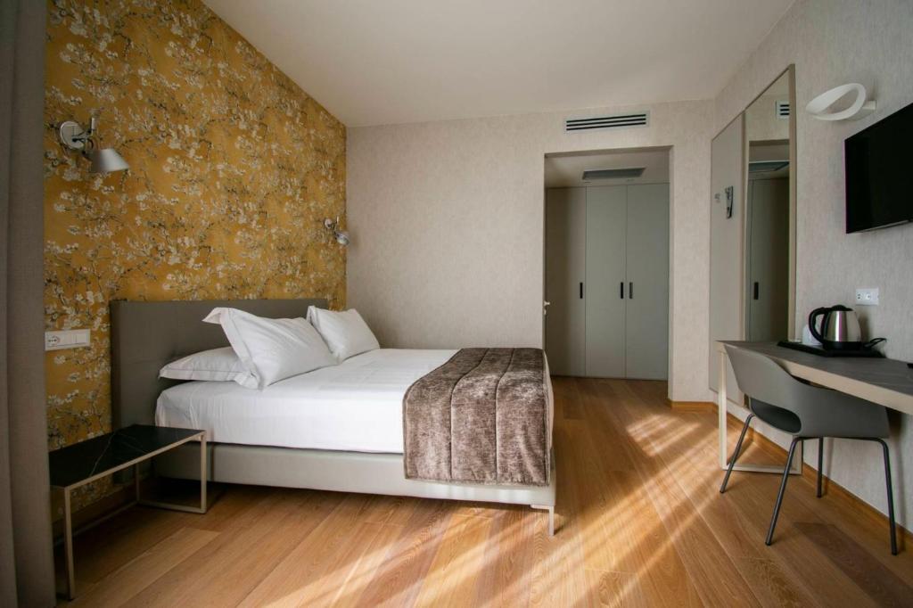 Postel nebo postele na pokoji v ubytování Hotel Medusa
