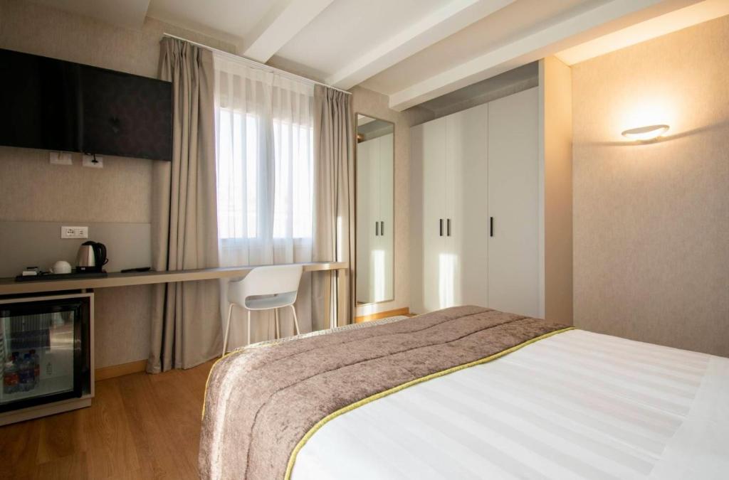 Postel nebo postele na pokoji v ubytování Hotel Medusa