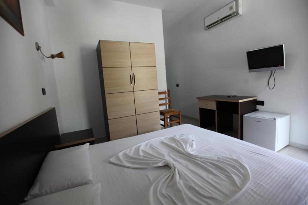 Postel nebo postele na pokoji v ubytování Hotel Colosseo