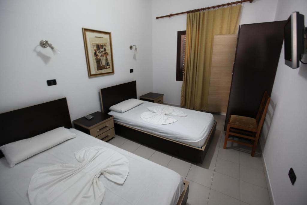 Postel nebo postele na pokoji v ubytování Hotel Colosseo