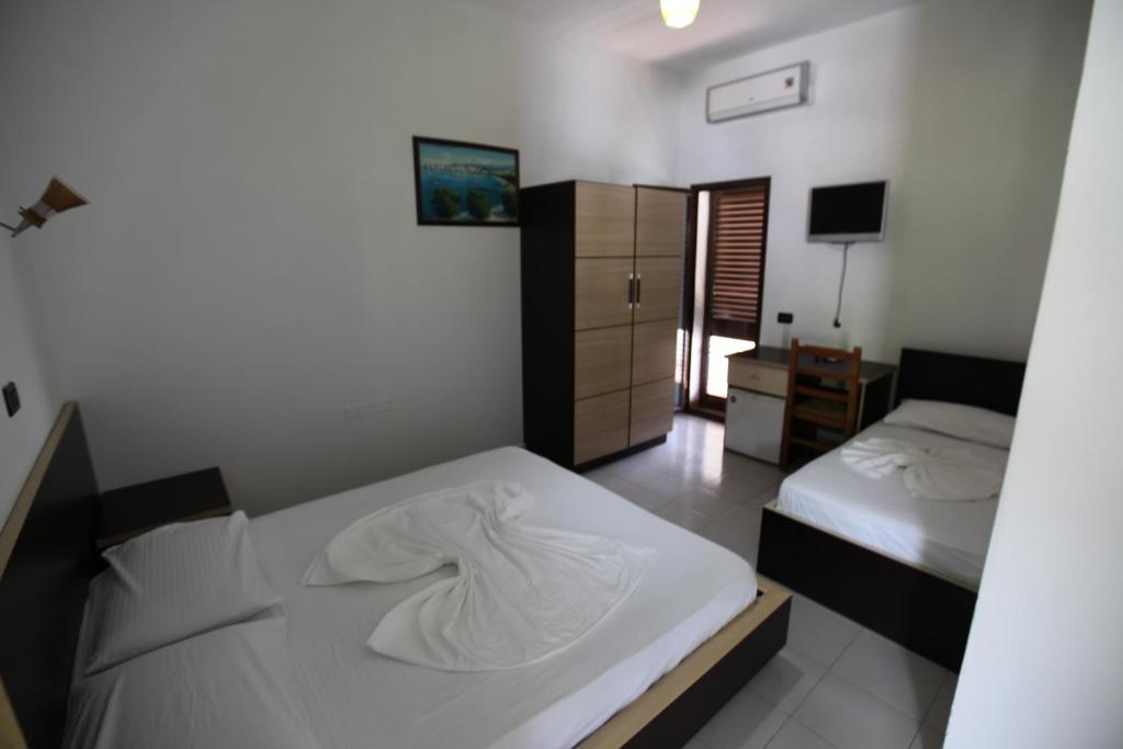 Postel nebo postele na pokoji v ubytování Hotel Colosseo