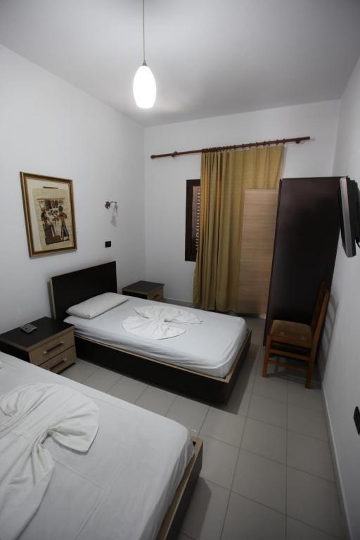 Postel nebo postele na pokoji v ubytování Hotel Colosseo
