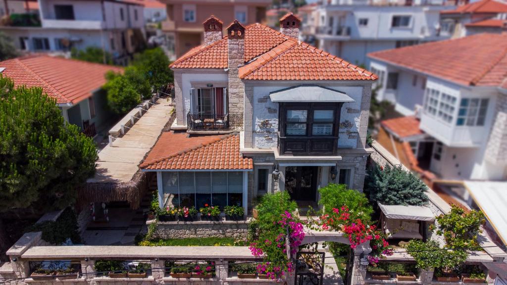 a model of a house with an orange roof at PROVENCE MANSİON ALAÇATI in Alacati
