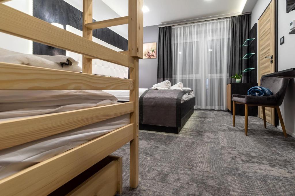 Postel nebo postele na pokoji v ubytování Arany Apartman Miskolc