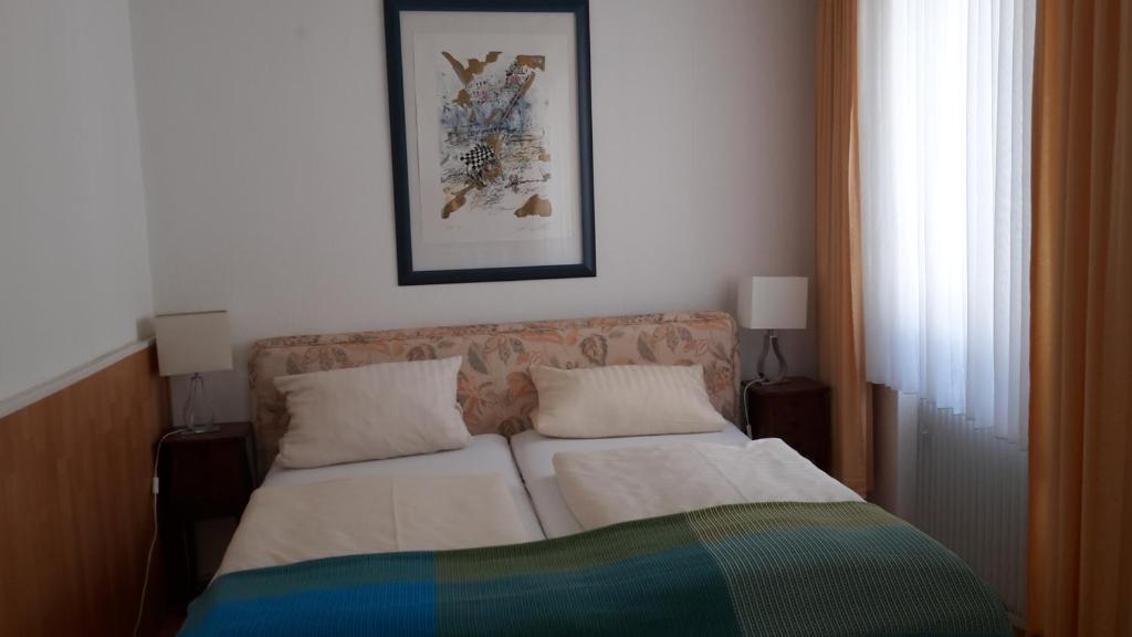 Postel nebo postele na pokoji v ubytování Hotel Rhein-Residenz