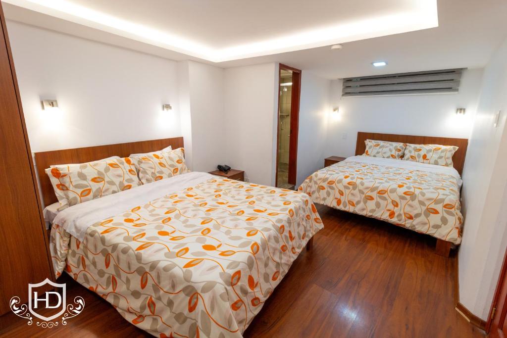 Postel nebo postele na pokoji v ubytování Hotel David