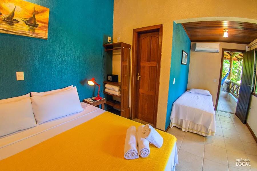 Postel nebo postele na pokoji v ubytování Casa Bonita Hospedagem e Café