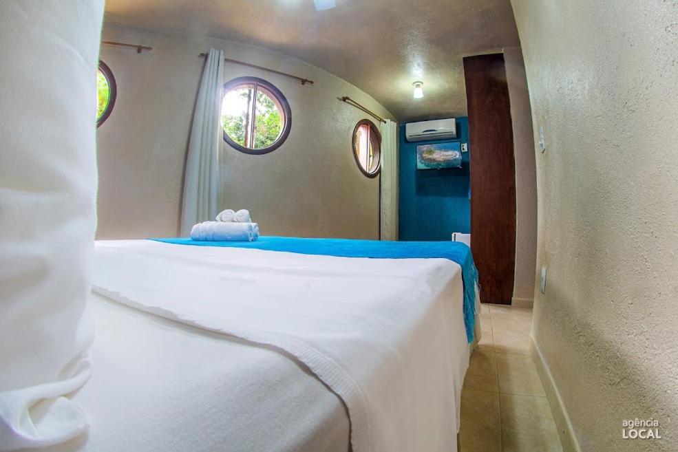 Postel nebo postele na pokoji v ubytování Casa Bonita Hospedagem e Café