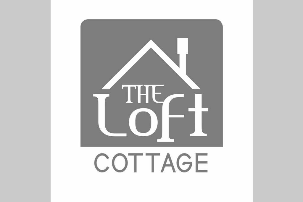 un logo per la società di caffè Let Off di The Loft Cottage a Glastry