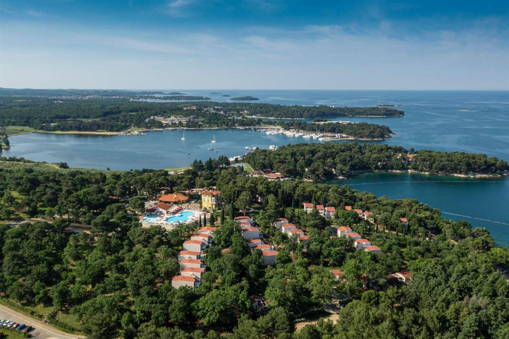 an aerial view of a small island in a body of water at Apartments Bellevue Plava Laguna in Poreč