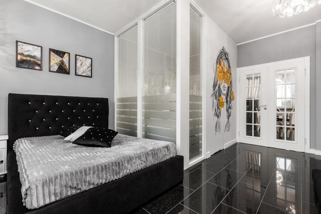 Posteľ alebo postele v izbe v ubytovaní Apartamenty Świętojańskie Gdynia