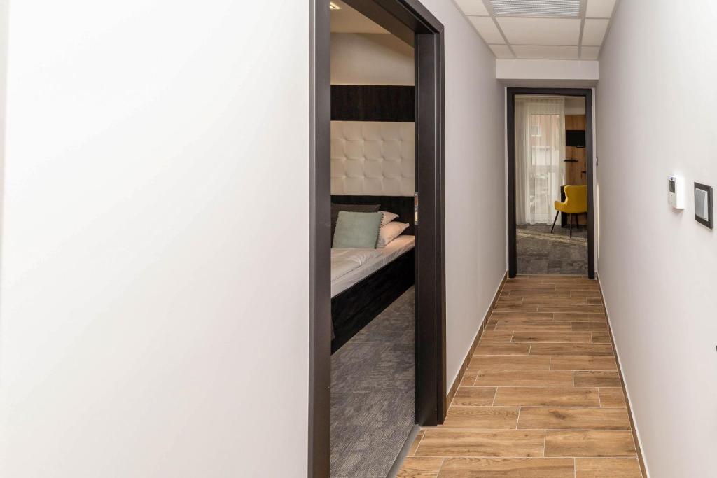 Postel nebo postele na pokoji v ubytování Arany Apartman Miskolc