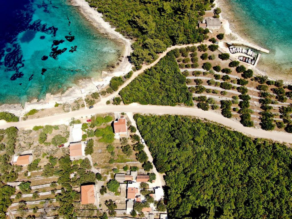 an aerial view of a beach and the ocean at Stone House Blaca in Blato