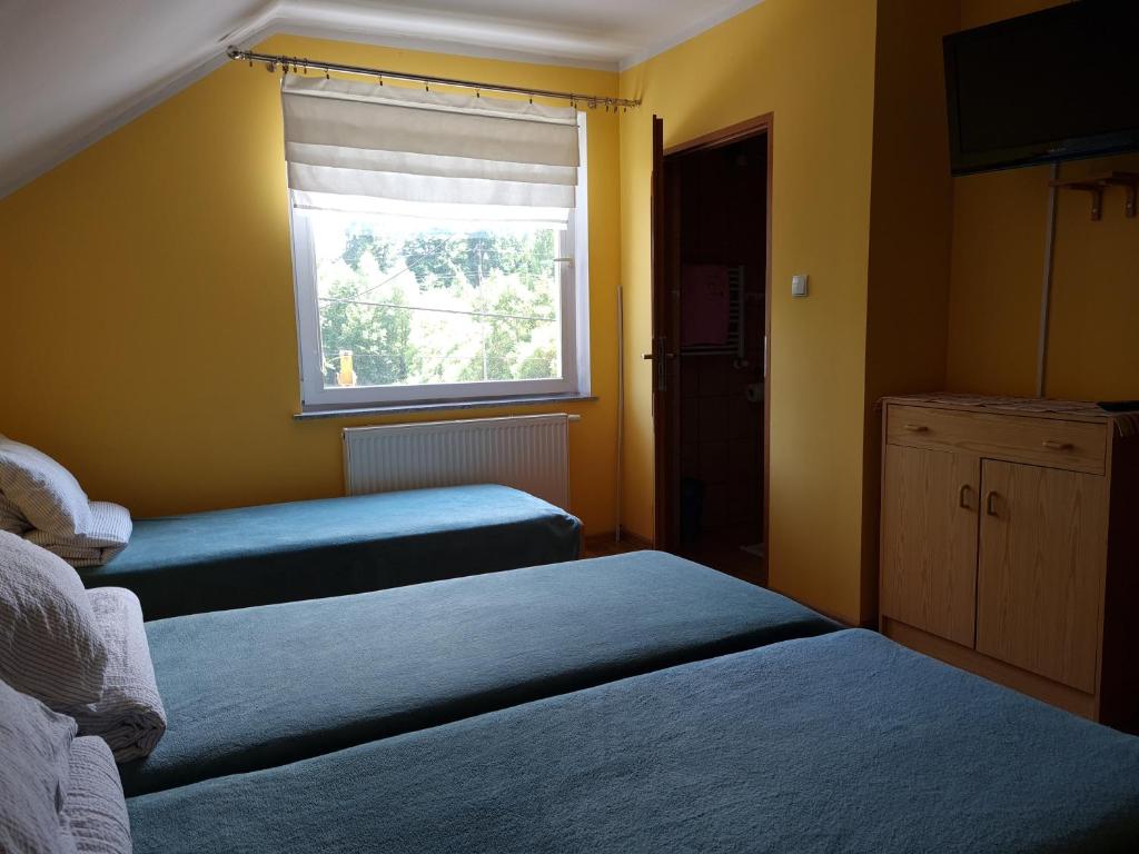 Postel nebo postele na pokoji v ubytování Stara Mleczarnia
