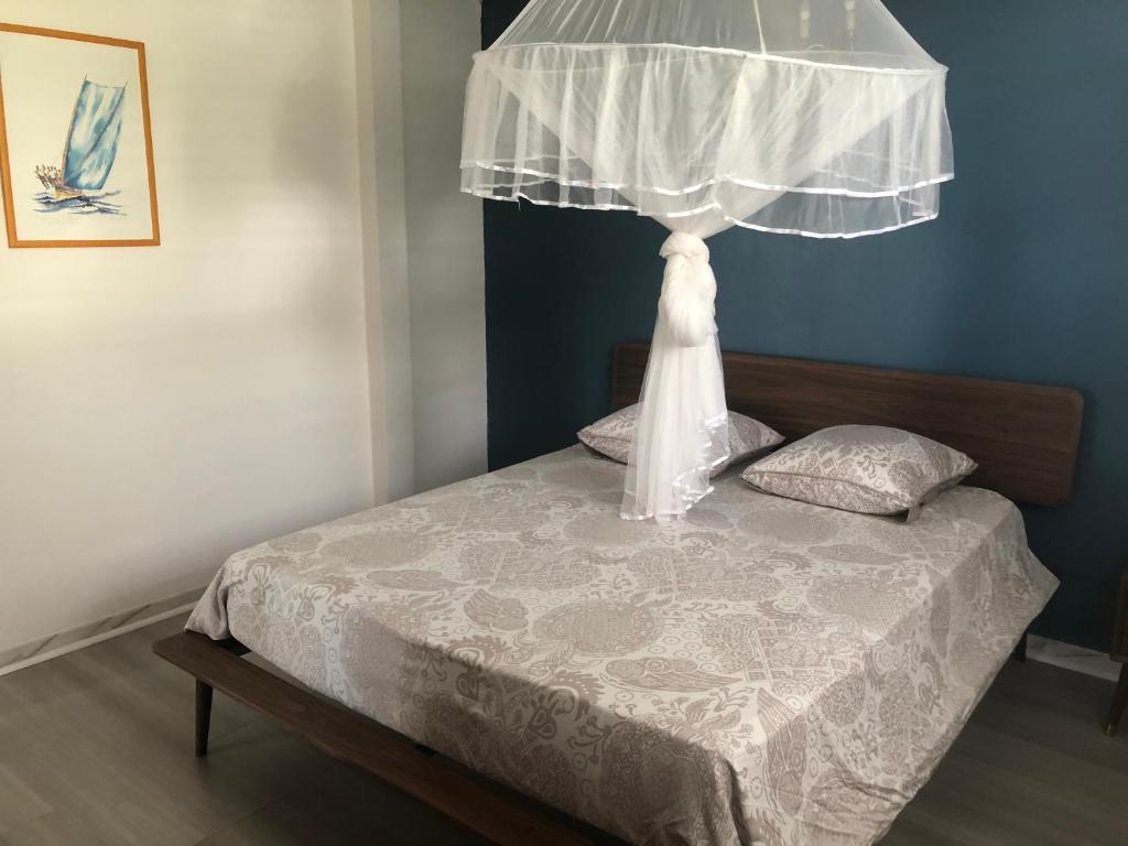 Postel nebo postele na pokoji v ubytování Villa Ti'Kemy avec piscine au sel