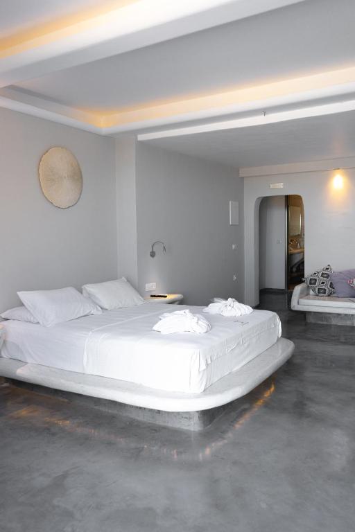 Postel nebo postele na pokoji v ubytování Demilmar Luxury Suites