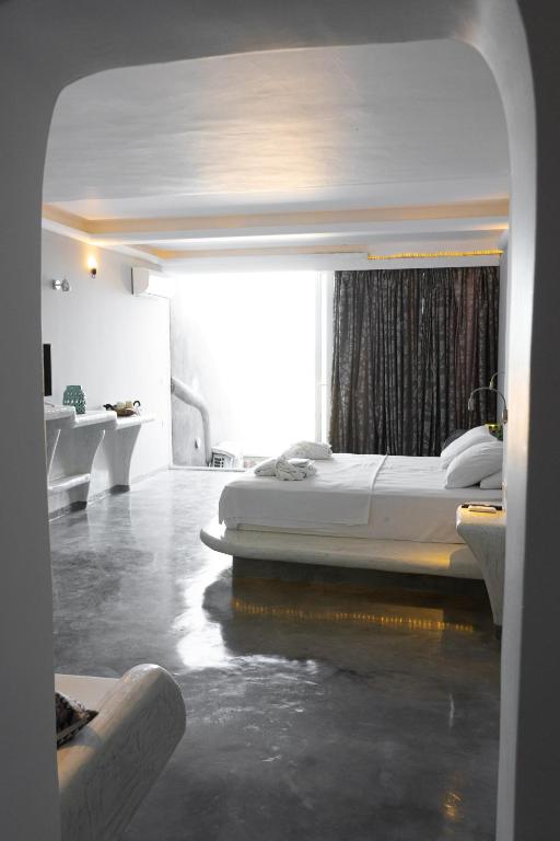 Postel nebo postele na pokoji v ubytování Demilmar Luxury Suites
