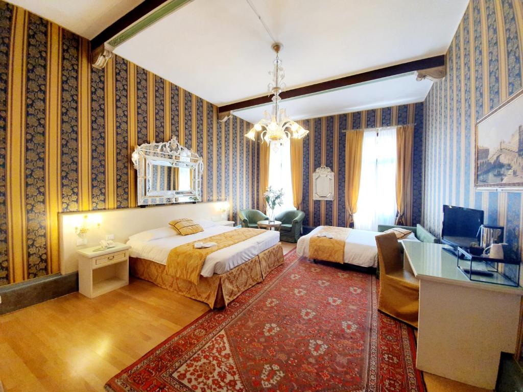Postel nebo postele na pokoji v ubytování Hotel Corte dei Greci